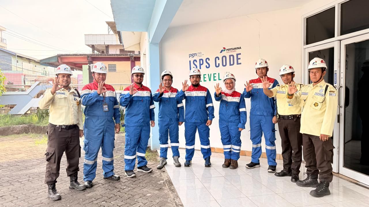 Team and security personnel at ISPS Code port facility signage